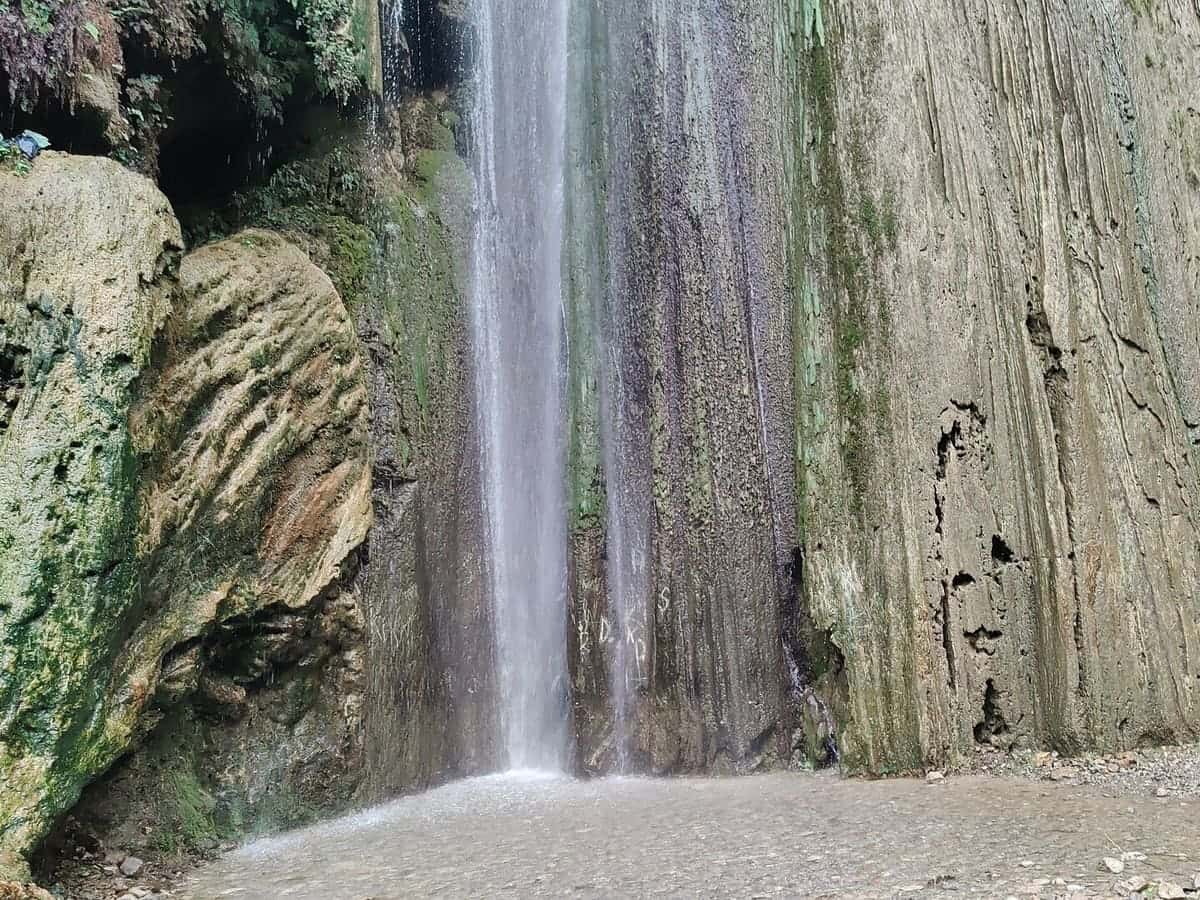 Neer Garh waterfall dropping down a rock face near Rishikesh