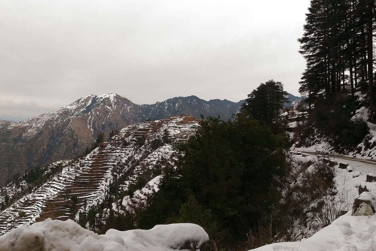 Snow-dusted terraced hills near Mussoorie