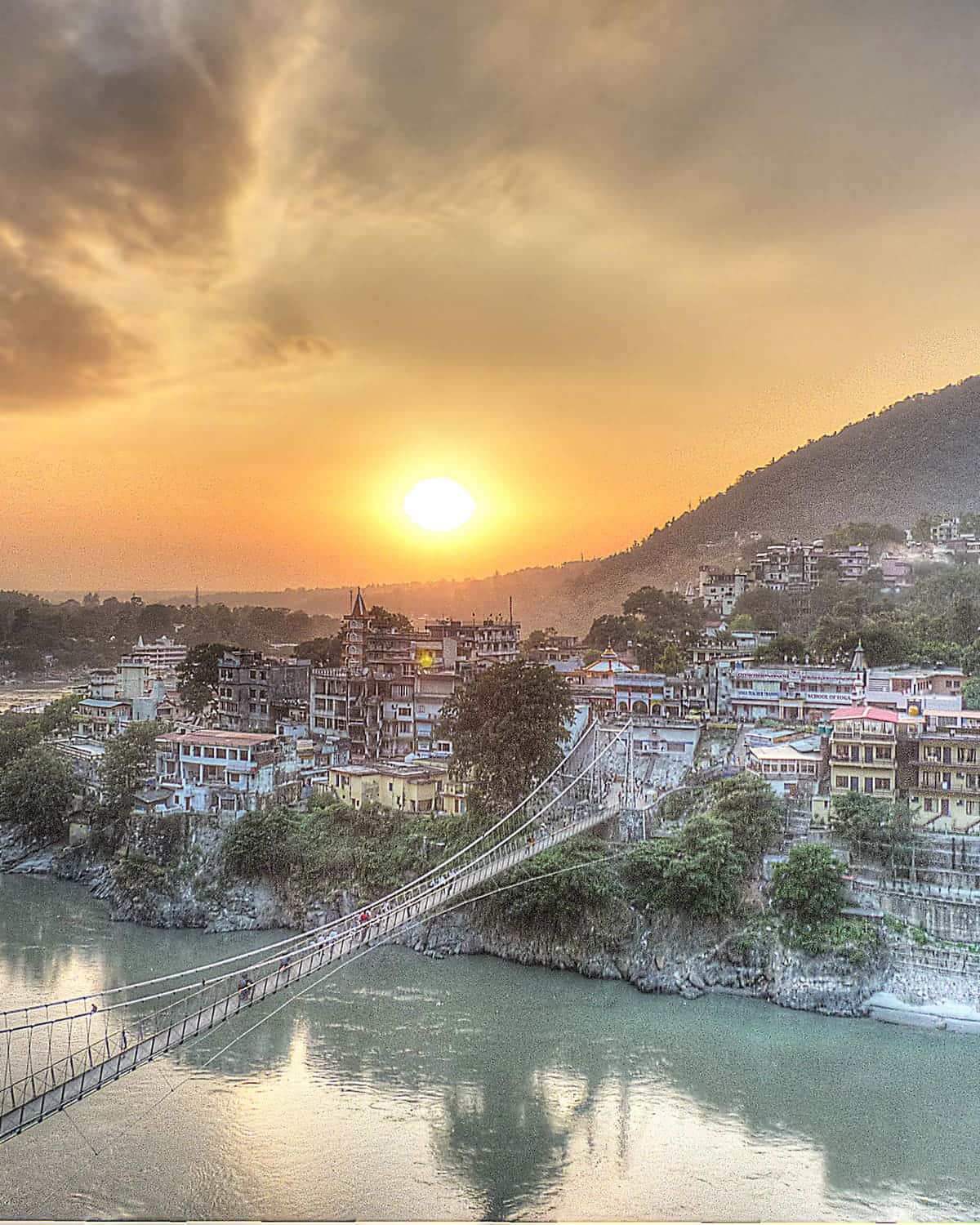 Sunset over Lakshman Jhula bridge and the Ganga in Rishikesh